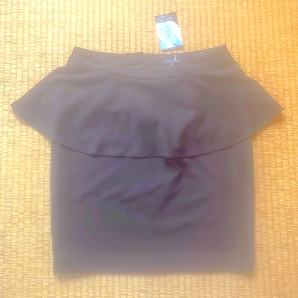 New Cynthia Rowley black peplum skirt. 5% elastic for ease of movement.